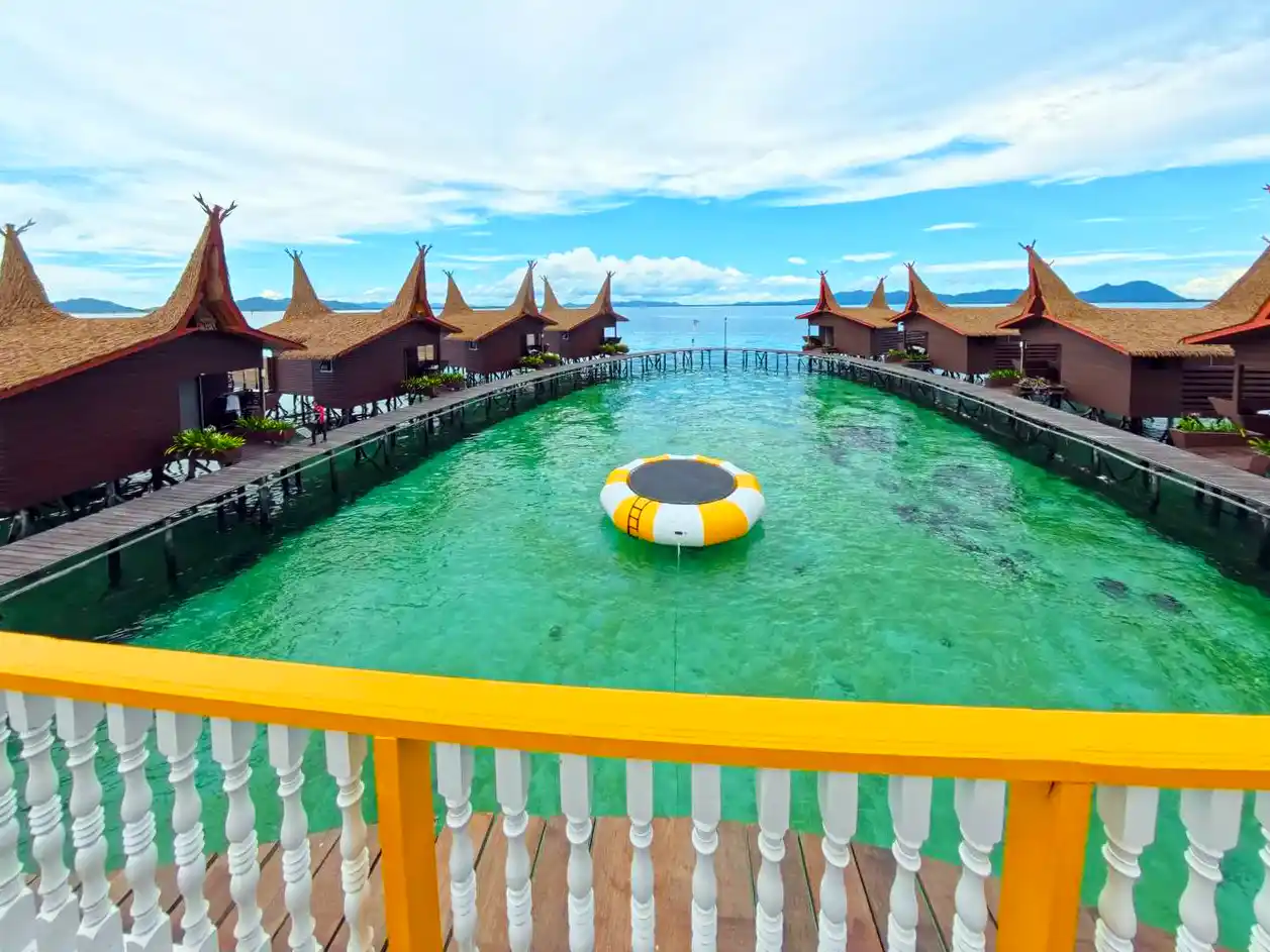 Enjoy panoramic views from our main terrace. Panoramic view from the main terrace at Dayang Resort, overlooking the beautiful overwater chalets and the giant sea trampoline in the lagoon.